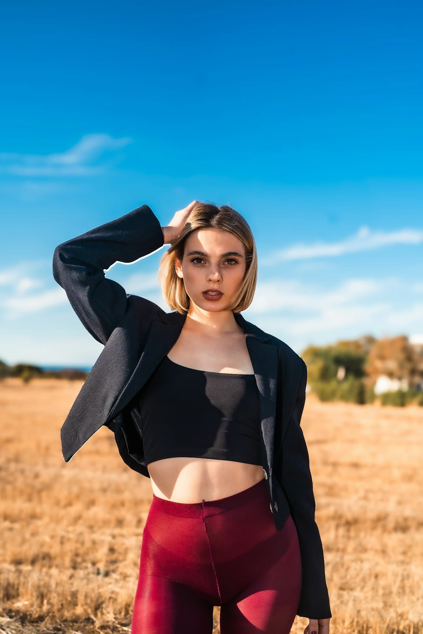 Founder portrait in a tailored blazer outdoors