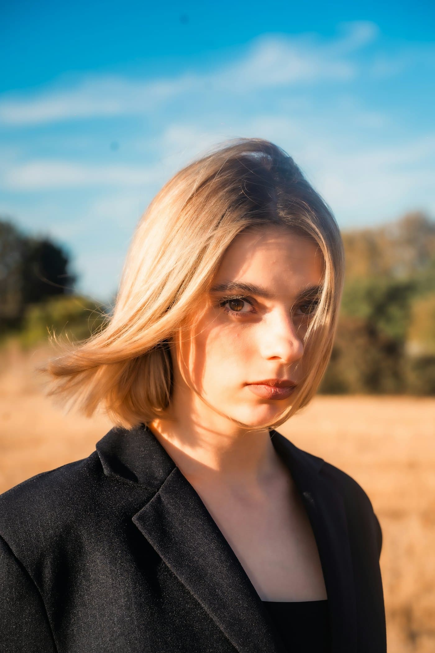 Founder portrait standing in an open field