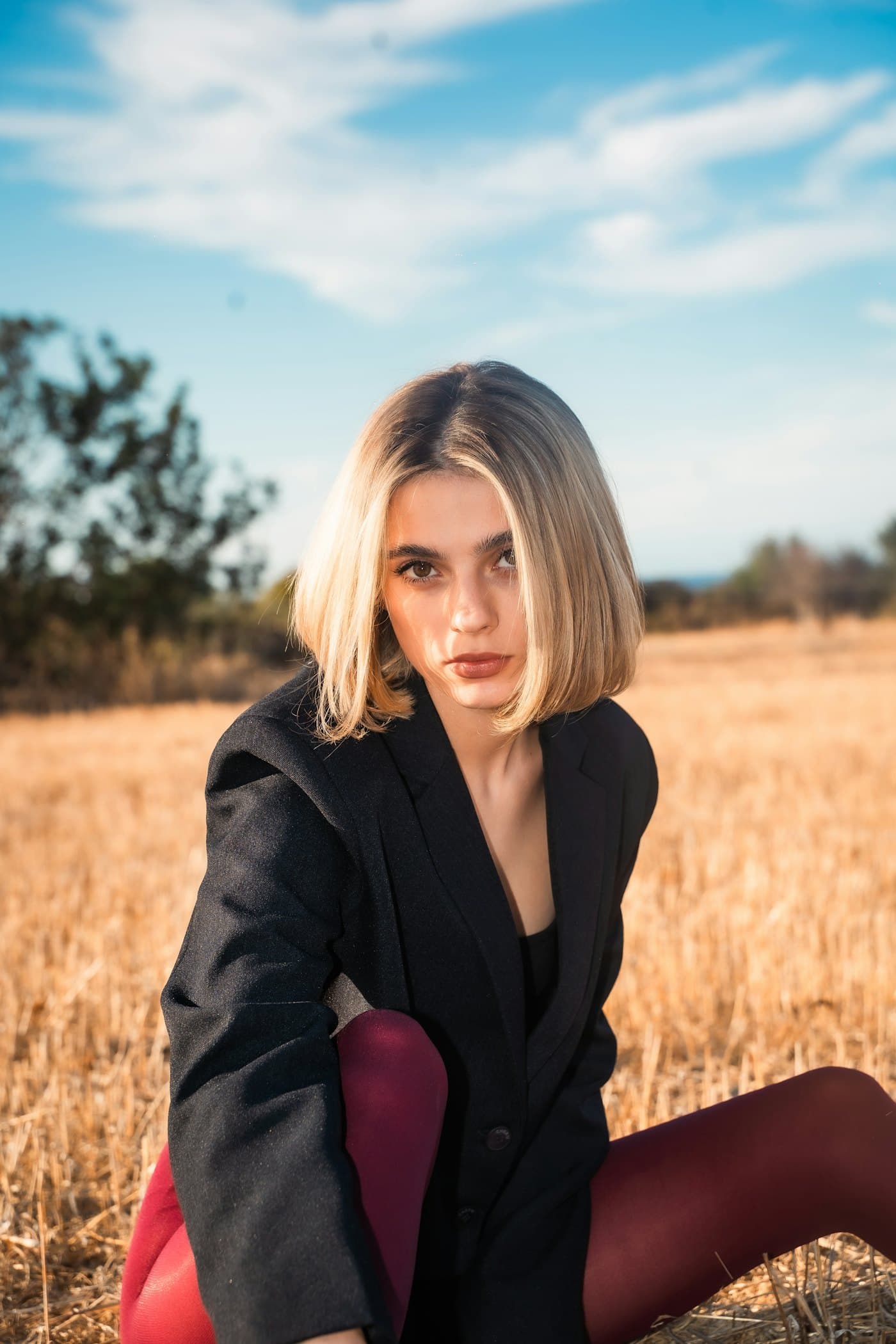 Founder portrait in a tailored blazer at dusk