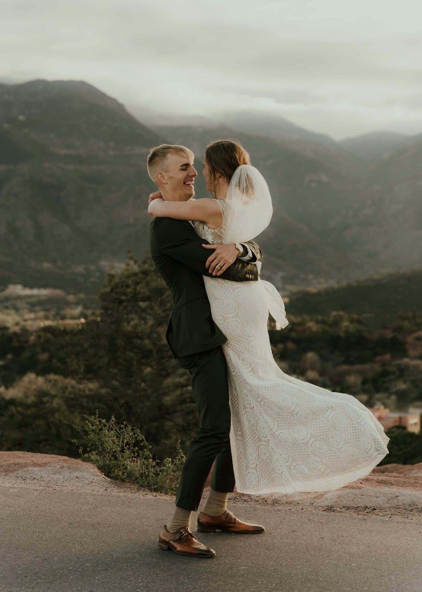 Couple hugging at a mountain summit
