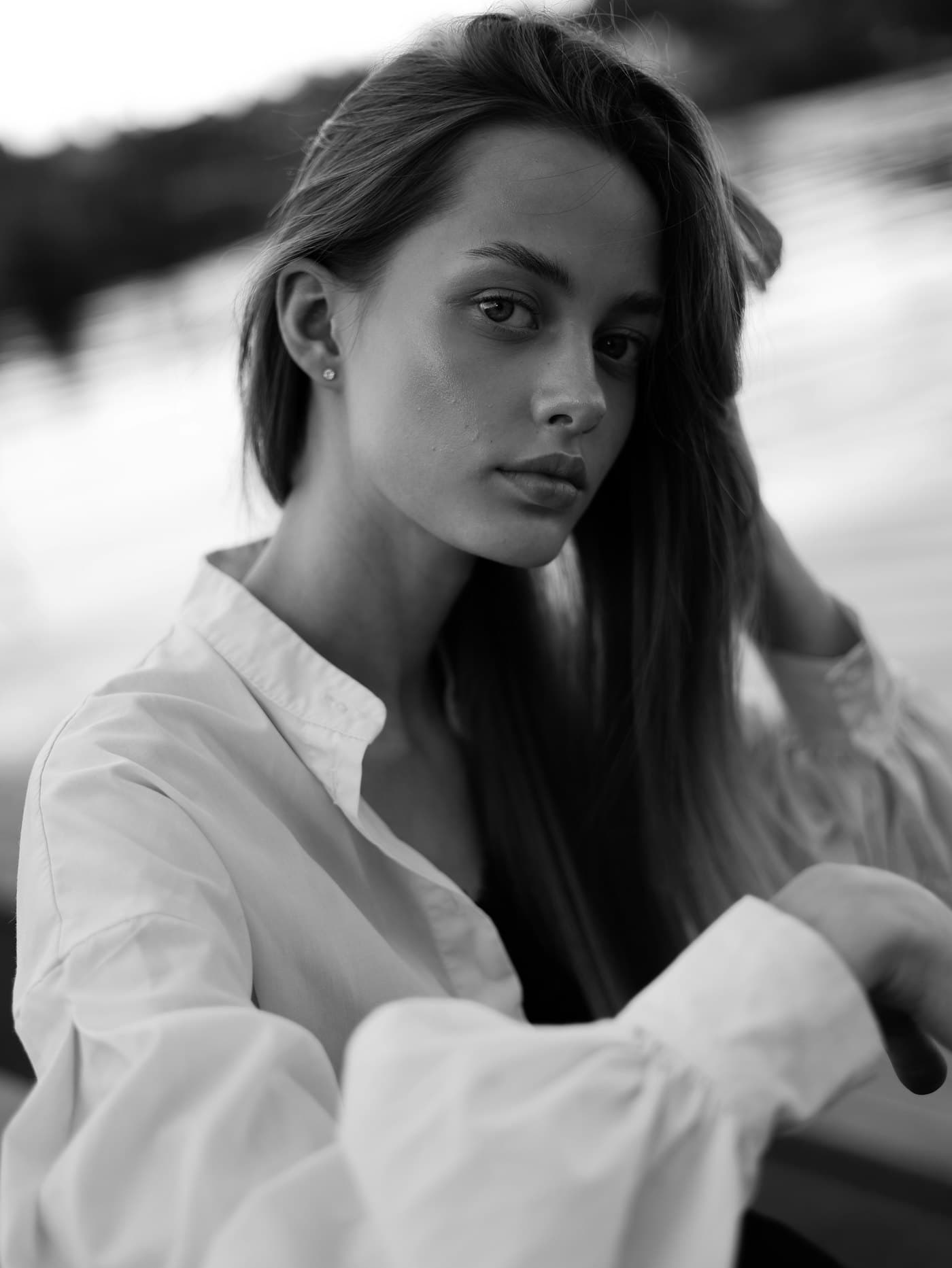 Portrait of a woman near still water