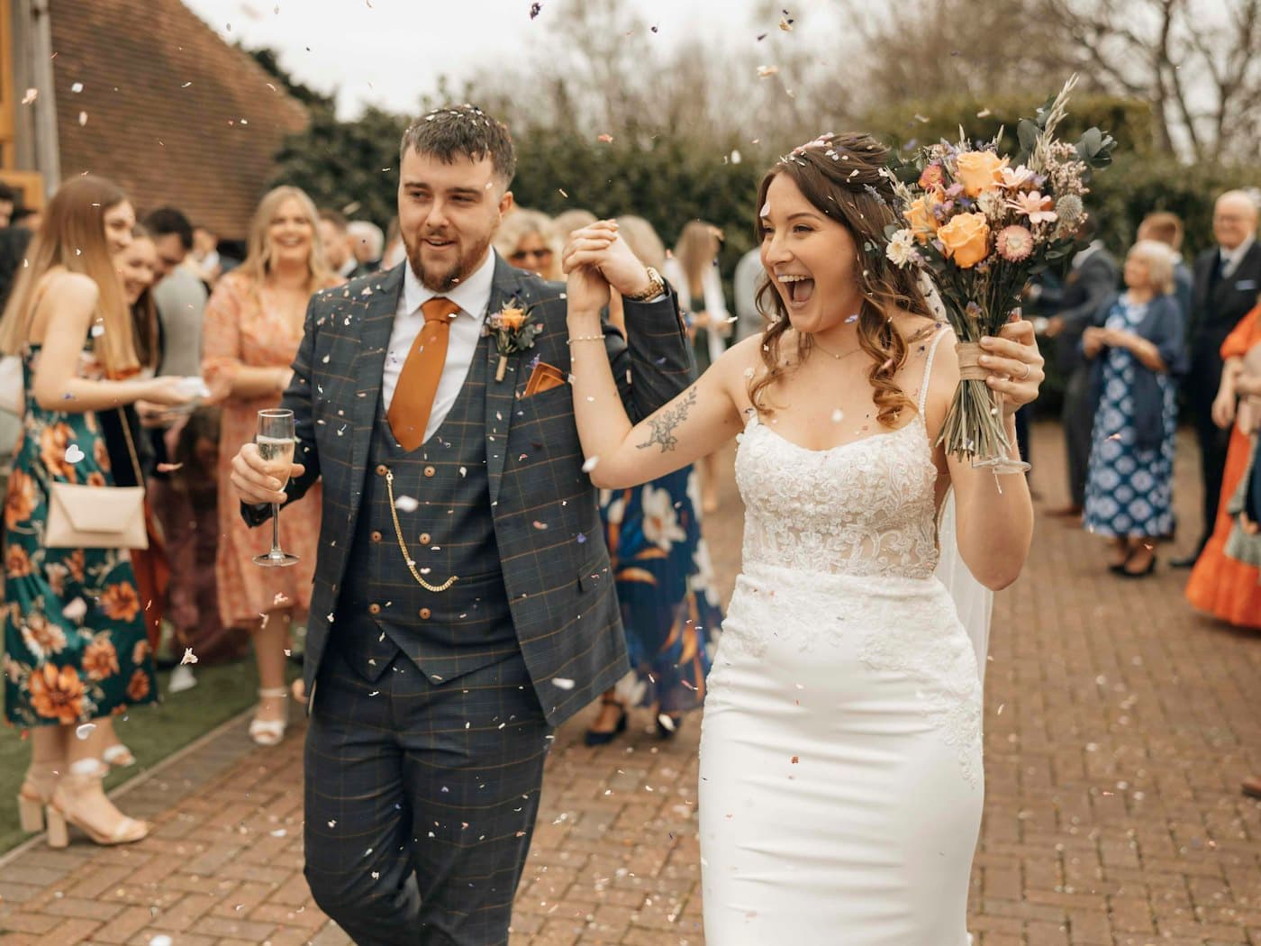 Newly married couple walking down the aisle