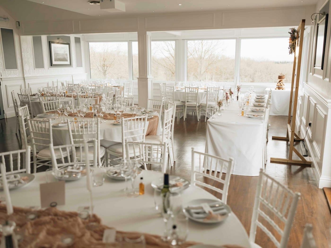 Reception room set with white tables and chairs