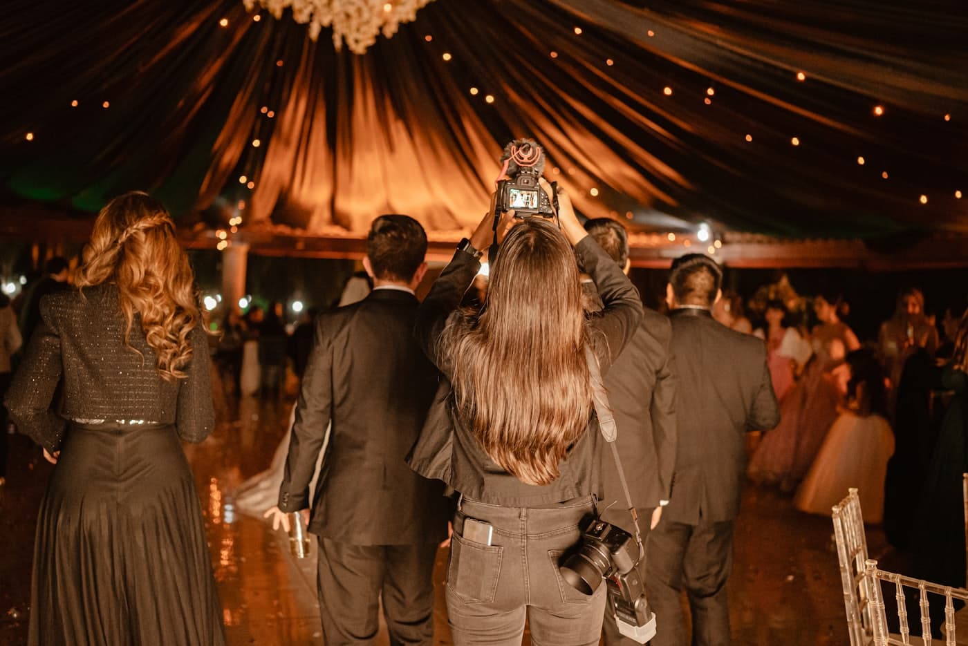 Guests documenting the ceremony
