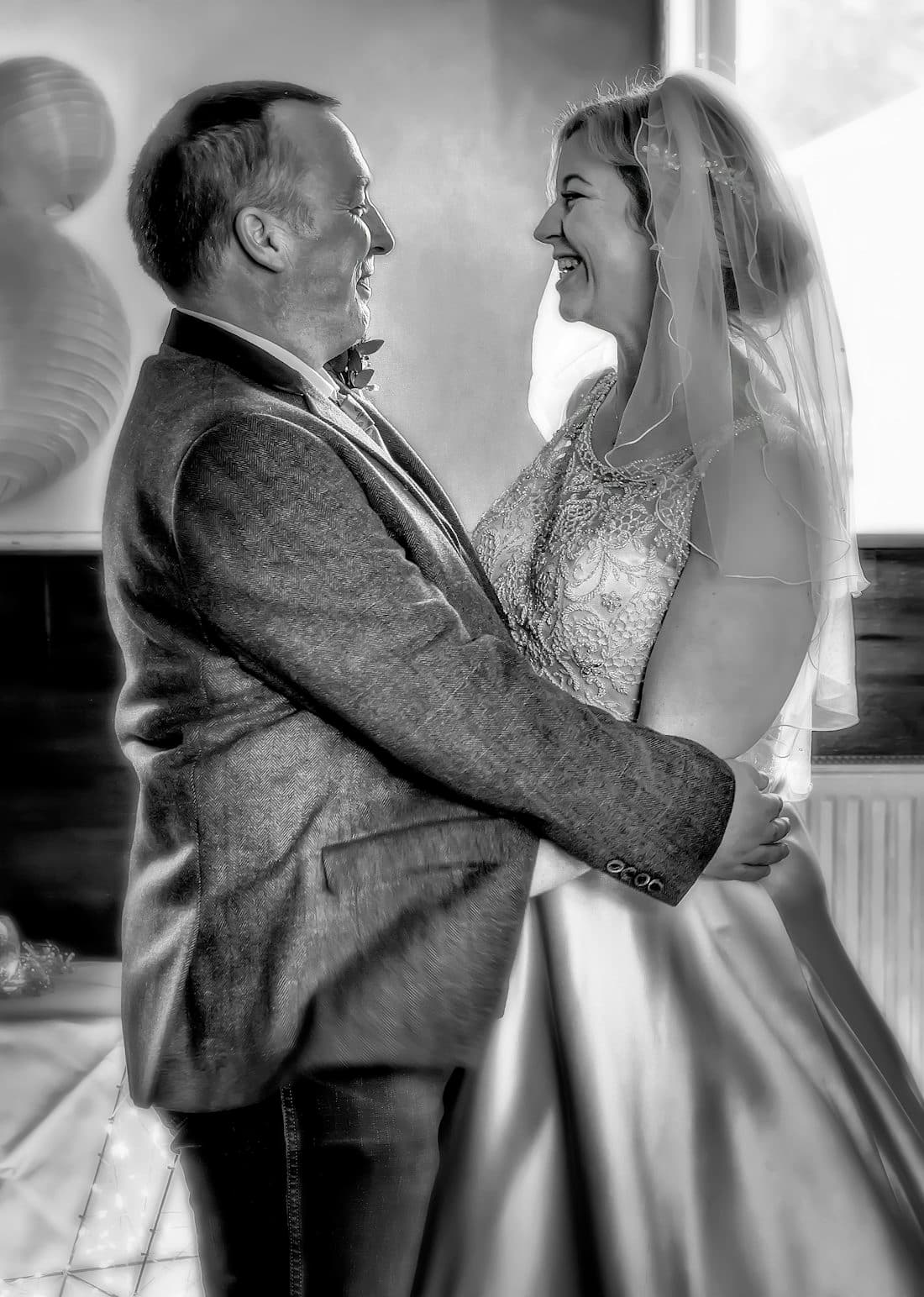 Newlywed couple laughing together