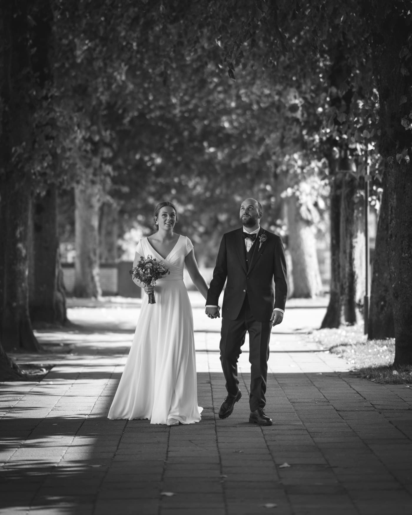 Bride and groom walking hand in hand